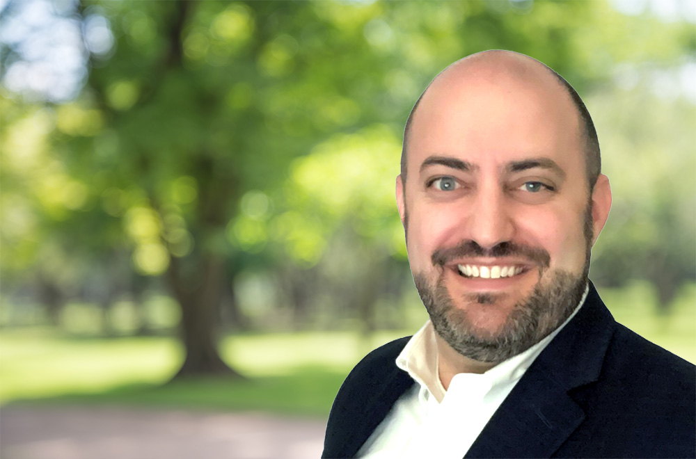 David Bernstein, an expert from Weston Solutions, smiling in a professional headshot against a blurred outdoor park background.