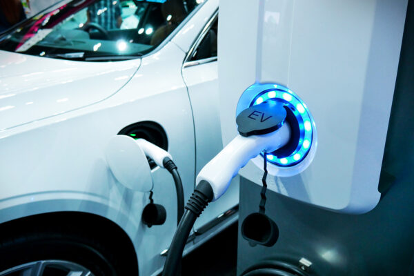 Power supply connect to electric vehicle for charge to the battery. Charging technology industry transport which are the futuristic of the Automobile. EV fuel Plug in hybrid car.